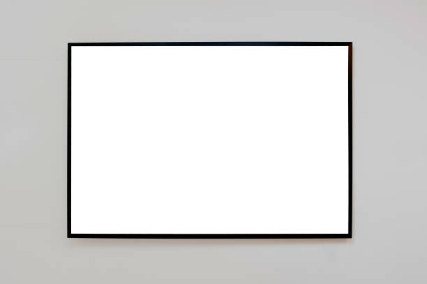 istock Mock up black frame for picture, advertisement or poster on a gray wall 945732978