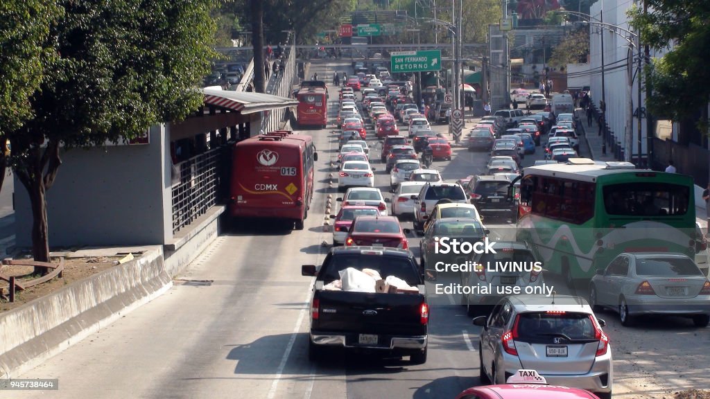 Mexico City Rush Hour Road Traffic Jam, Office Building Exterior And Tree View In Mexico Scene Of Tree, Building Exterior, Advertising Sign, People Walking, Waiting For Public Transportation Bus At Bus Station And Traffic Jam During Rush Hour In Mexico City Mexico Mexico City Stock Photo