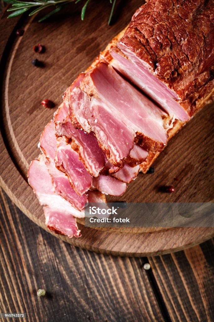 Smoked bacon with chopped slices, ready to prepare a traditional Smoked bacon with chopped slices, ready to prepare a traditional breakfast with eggs. Eating habits concept. Top view Bacon Stock Photo