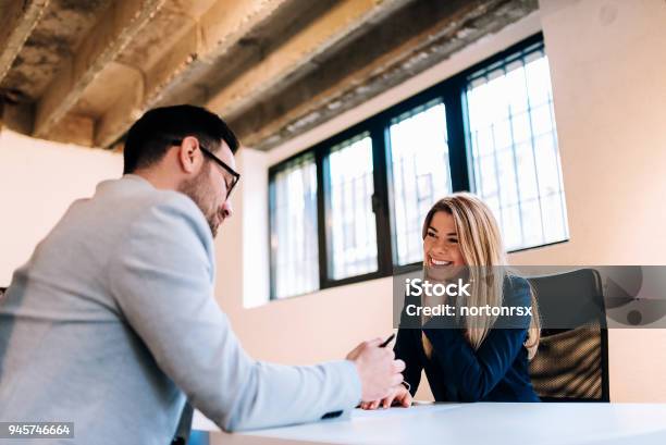 Business Partners Having A Meeting And Discussing Their Business Plans Stock Photo - Download Image Now