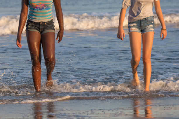 teenager walking in the ocean