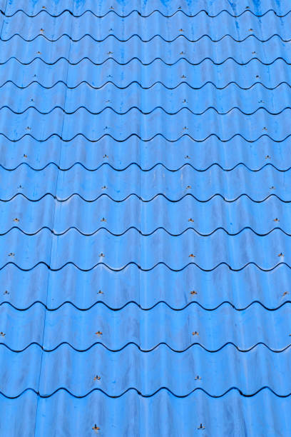 istock Blue roof tiles or shingles on house as background image 945765772