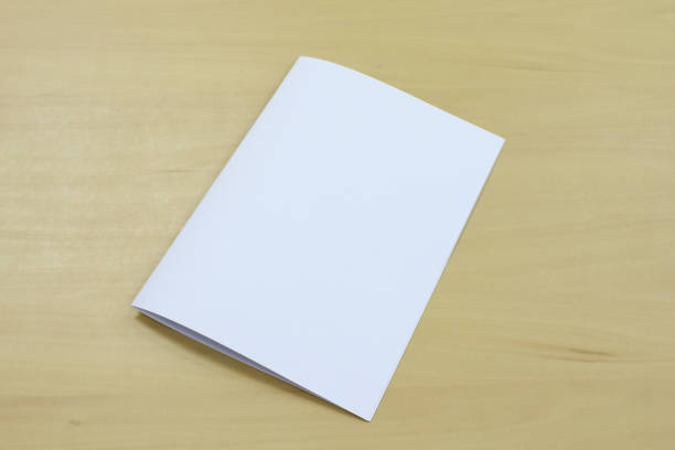 istock The white paper on the wooden table. 945782972