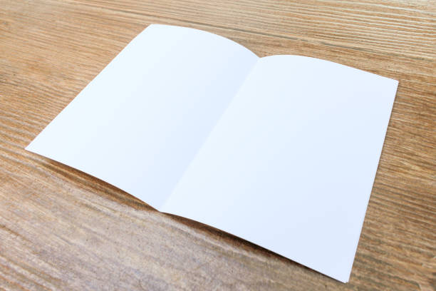 istock The white paper on the wooden table. 945782978