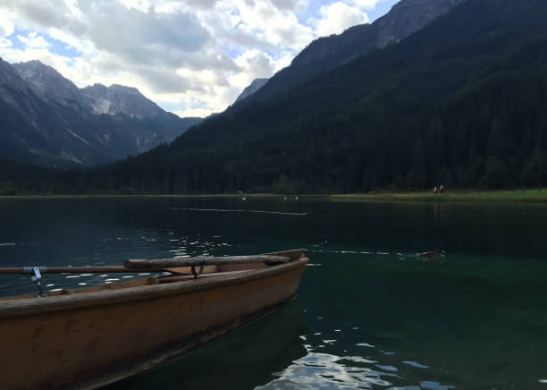 istock Rowing boat in a lake in the mountains 945785654