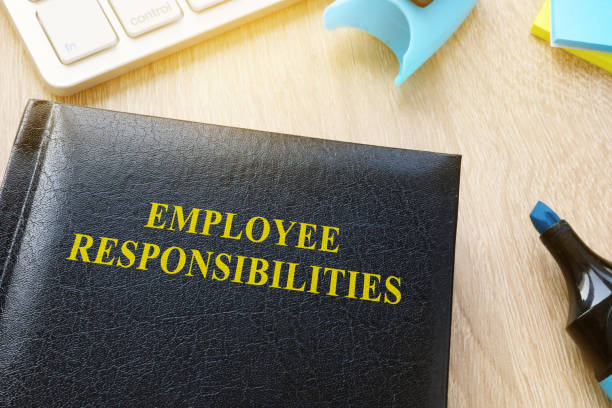 istock Book about Employee responsibilities on an office table. 945786590