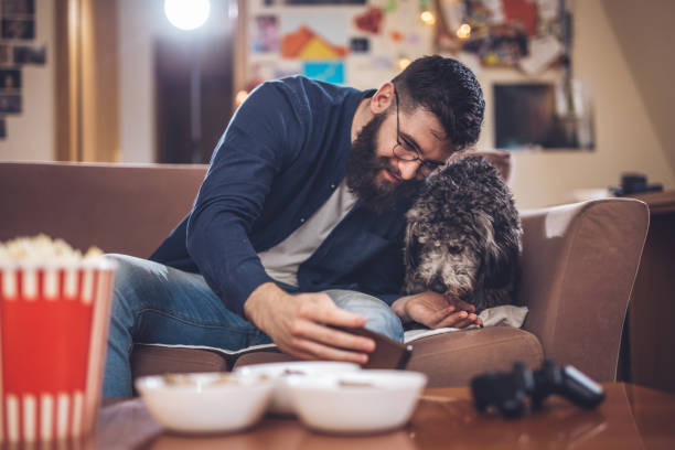 istock Bearded man doing selfies with his dog 945819282
