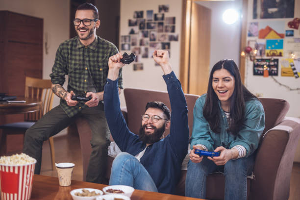istock Winning against friends in video games 945824022