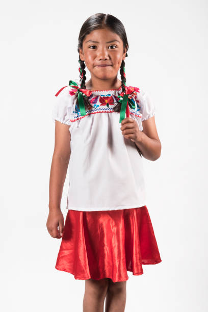 istock Hispanic girl with native embroidered blouse 945824024