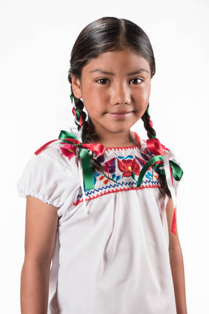 istock Hispanic girl with native embroidered blouse 945824848