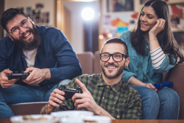 istock Good friends playing games at home 945825110