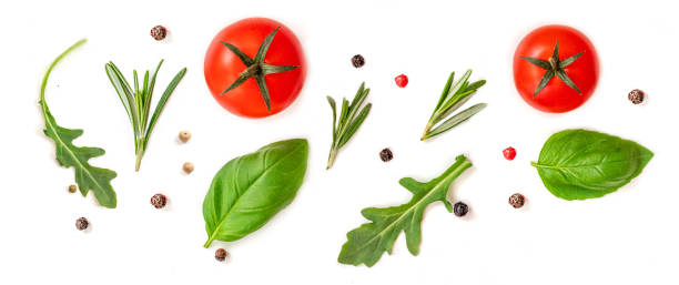 istock Tomato, rosemary and basil leaf  isolated on white background, top view. Creative layout with fresh organic vegetables and spices. Flat lay. Food concept.