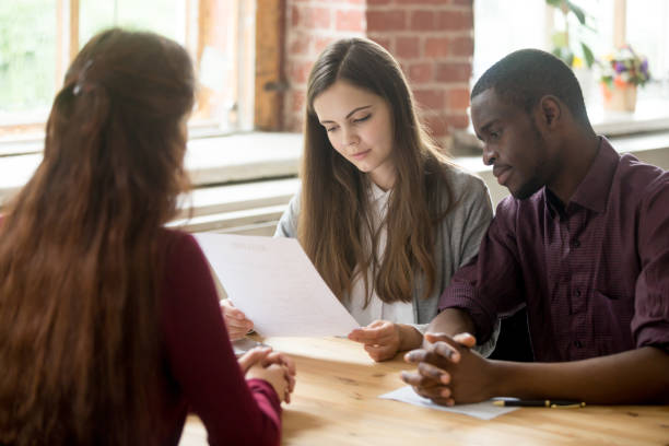istock Multiracial managers reading applicant resume during hiring 945837716