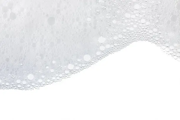 Photo of Foam bubbles abstract white background.