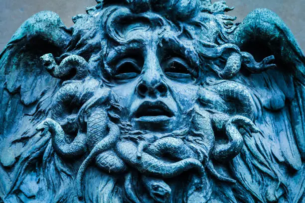 Italy, Turin. This city is famous to be a corner of two global magical triangles. This is a Medusa's head made of bronze close to the historical garden of Valentino in Turin.