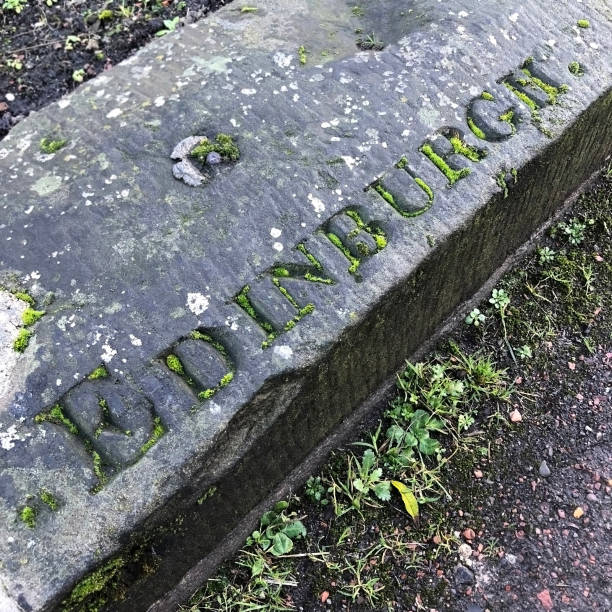 istock Edinburgh Carved In Stone With Moss 945848398