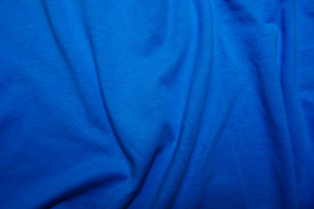 istock Creased blue cotton background 945849294