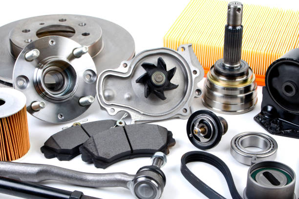 istock Auto parts background. Hub, pump, brake pads, filter, timing belt, rollers, constant velocity joints, thermostat and other on white background. Set of spare parts for repair 945849350