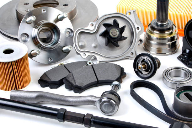 istock Auto parts background. Hub, pump, brake pads, filter, timing belt, rollers, constant velocity joints, thermostat and other on white background. Set of spare parts for repair 945849844