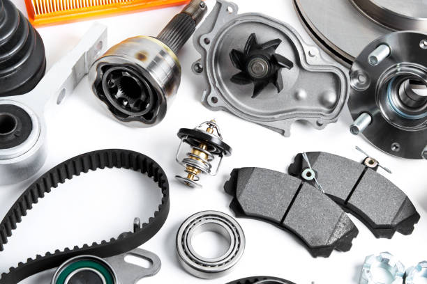 istock Auto parts background. Hub, pump, brake pads, filter, timing belt, rollers, constant velocity joints, thermostat and other on white background 945849988