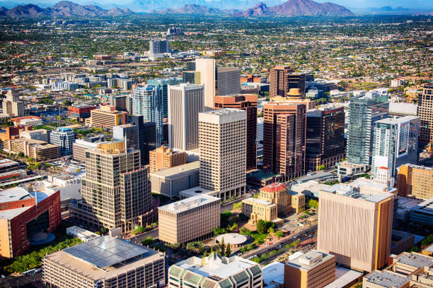Downtown Phoenix Aerial View An aerial view of downtown Phoenix, Arizona and the surrounding urban area. aircraft point of view stock pictures, royalty-free photos & images