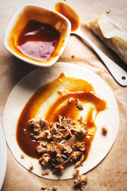 Beijing style duck pancakes with hoisin sauce Beijing style duck pancakes with hoisin sauce hoisin sauce stock pictures, royalty-free photos & images