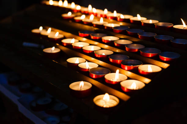 istock Square of burning candles in the darkness 945858056