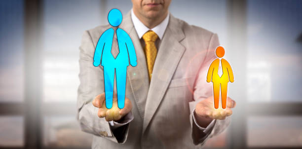 istock Manager Contrasting Small Versus Big Male Worker 945858426