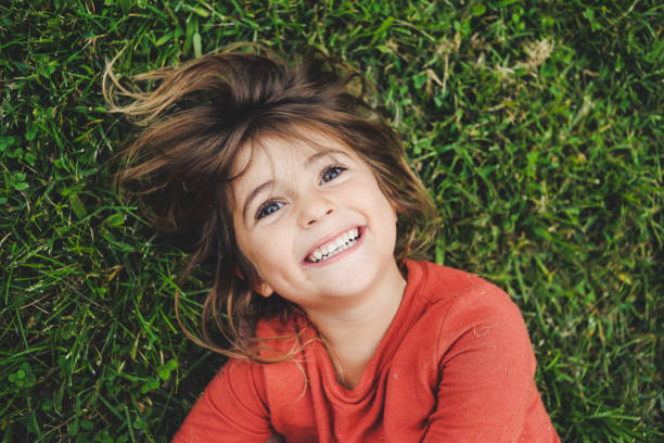 istock Girl in the Grass 945861386
