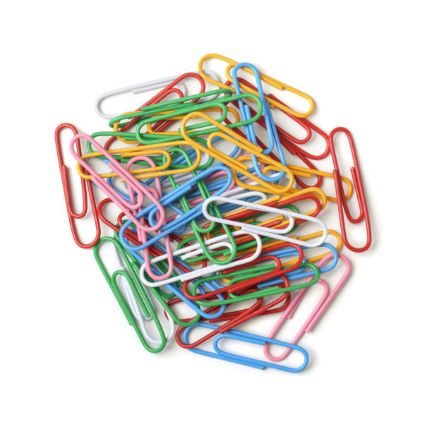 Paper clips Top view of color paper clips isolated on white paper clip office supply stack heap stock pictures, royalty-free photos & images