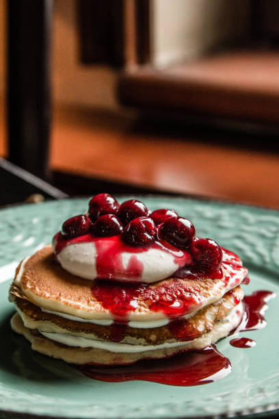 istock Delicious american pancakes on a green rustic plate 945867276