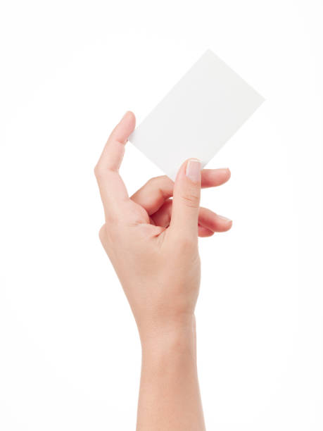 istock Woman Hand holding an empty business card 945882242