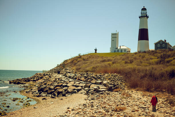 istock Panoramic view on Montauk Point State Park Lighthouse and the Atlantic Ocean. Long Island, New York State 945885340