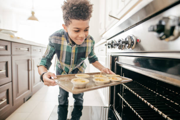Teenager baking cookies