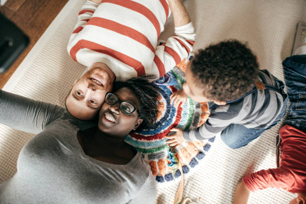 istock Family lying on the floor 945885656