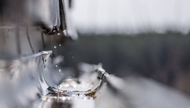 istock Jets and drops of water falling from the roof 945885906