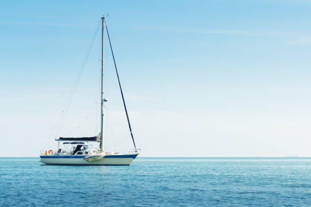 istock Yacht in the sea against blue sky 945892954