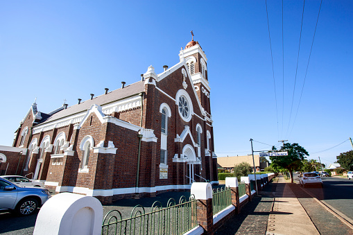 View of the iconic St Mary Catholic Church, a red brick Romanesque church erected during the period of Pope Pius XI, in West Wyalong, New South Wales, Australia