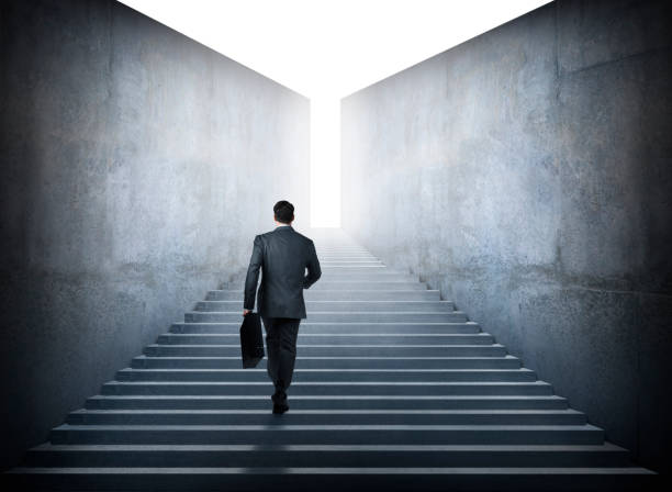 istock Businessman Climbing Stairs 945913204
