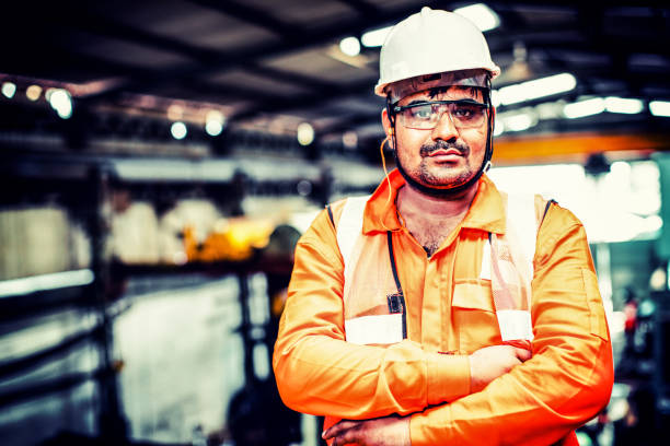 istock Indian factory blue collar worker showing a serious facial expression. 945921278