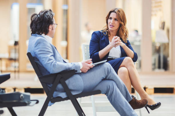 istock Business couple talking on the modern offices 945924516