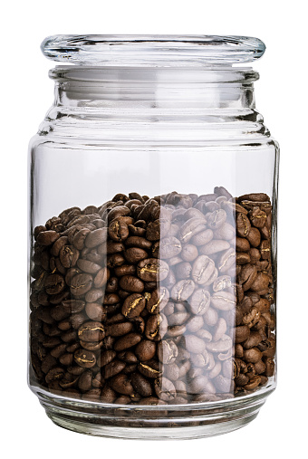 Glass jar with coffee beans isolated with shadow. Clipping path.