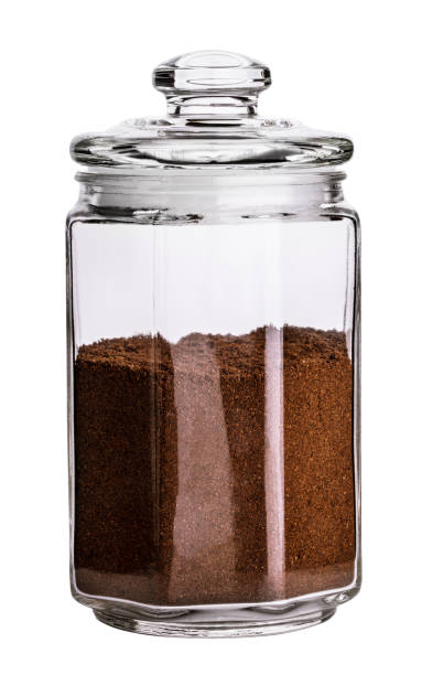 istock Glass jar with coffee beans isolated. Clipping path. 945932472