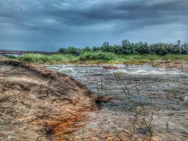 River and clouds turn wild when it's going to rain