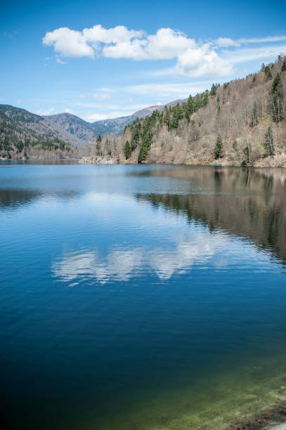 istock lake of Kruth with cloud reflection in alsace 945954058