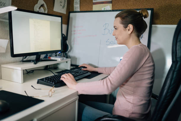 istock Beautiful woman working in home office and using computer 945955212