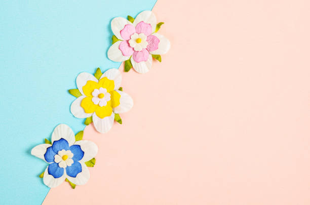 istock Romantic beautiful artificial colorful flowers with empty space. 945958294