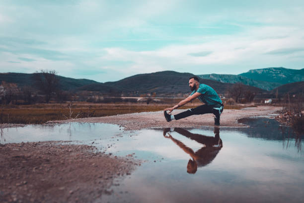 istock Athlete exercising outdoors on a sunny day 945961154
