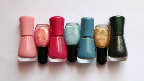 istock bottles with multi-colored nail polish on a white background. bright nail polish. color manicure. 945961888