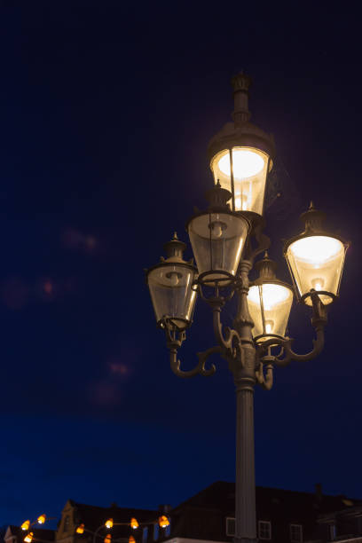 istock streetlamp on blue hour sunset sky 945965140